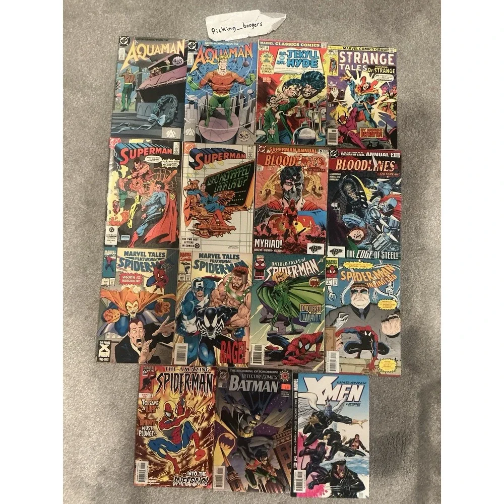 Vintage 15 lot of superhero comic books from both DC and Marvel publishers.